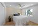Bright bedroom features a geometric accent wall, fan, and window at 616 Fern St, Anna Maria, FL 34216