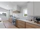 Gourmet kitchen with marble countertops, stainless steel appliances, and ample cabinet space at 616 Fern St, Anna Maria, FL 34216