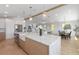 Bright open-concept kitchen with a spacious island, stainless appliances, and seamless flow to living areas at 616 Fern St, Anna Maria, FL 34216
