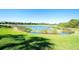 Scenic view of the tranquil pond and golf course at 6509 Grand Estuary Trl # 201, Bradenton, FL 34212