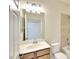 Bathroom featuring a large mirror, vanity, with shower and tub at 6509 Grand Estuary Trl # 201, Bradenton, FL 34212