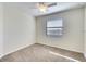 Spacious bedroom with a ceiling fan and large window for natural light at 6509 Grand Estuary Trl # 201, Bradenton, FL 34212