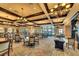 Elegant dining room with large windows, chandeliers, and well-appointed tables and chairs at 6509 Grand Estuary Trl # 201, Bradenton, FL 34212