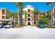 Condo complex with lush tropical landscaping and covered parking, offering a serene and convenient living environment at 6509 Grand Estuary Trl # 201, Bradenton, FL 34212
