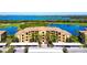 Spacious condo complex overlooks a golf course, ponds, and bay, with covered parking for residents and visitors at 6509 Grand Estuary Trl # 201, Bradenton, FL 34212