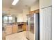Bright kitchen features stainless steel appliances, granite countertops, and ample cabinet space at 6509 Grand Estuary Trl # 201, Bradenton, FL 34212