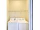 Convenient laundry room equipped with a washer, dryer and shelving at 6509 Grand Estuary Trl # 201, Bradenton, FL 34212