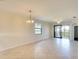 Bright living area with tile floors and golf course views, providing an inviting space for relaxation at 6509 Grand Estuary Trl # 201, Bradenton, FL 34212