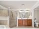 Primary bathroom offers walk-in shower, double vanity and private commode at 6923 Grand Estuary Trl # 101, Bradenton, FL 34212
