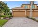 Charming townhome with a well-maintained brick driveway and a two-car garage at 6923 Grand Estuary Trl # 101, Bradenton, FL 34212