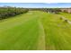 A meticulously maintained fairway invites golfers to play a round at 6923 Grand Estuary Trl # 101, Bradenton, FL 34212