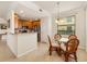 Bright eat-in kitchen nook; bar seating area and stainless steel appliances at 6923 Grand Estuary Trl # 101, Bradenton, FL 34212