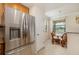 Kitchen with eat-in nook; stainless steel refrigerator and matching appliances at 6923 Grand Estuary Trl # 101, Bradenton, FL 34212