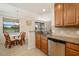 Bright eat-in kitchen nook with stainless steel dishwasher and granite countertops at 6923 Grand Estuary Trl # 101, Bradenton, FL 34212