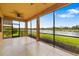 Spacious covered lanai with beautiful lake views, ceiling fan, and screened windows at 6923 Grand Estuary Trl # 101, Bradenton, FL 34212