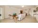 Open living area with tile floors, neutral walls, comfortable seating, and dining space in the background at 6923 Grand Estuary Trl # 101, Bradenton, FL 34212