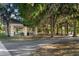 Shaded park area featuring a covered pavilion, picnic tables, and walking paths amidst lush trees and greenery at 6923 Grand Estuary Trl # 101, Bradenton, FL 34212
