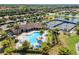 Aerial view of a zero entry pool and lounging area located at the community clubhouse at 6923 Grand Estuary Trl # 101, Bradenton, FL 34212