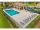 Pool with lots of seating and cabana in fenced in area at 6923 Grand Estuary Trl # 101, Bradenton, FL 34212