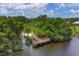 Aerial view of community dock with convenient lake access amid lush, green surroundings at 6929 Stetson Street Cir, Sarasota, FL 34243