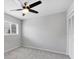 Neutral bedroom with gray carpeting, ceiling fan and a window at 6929 Stetson Street Cir, Sarasota, FL 34243