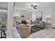 Spacious living room with a fireplace, stylish furniture, and neutral decor at 6929 Stetson Street Cir, Sarasota, FL 34243