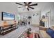 Spacious living room with modern decor, including plush seating, elegant dining area, and bright natural light at 6929 Stetson Street Cir, Sarasota, FL 34243