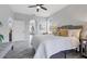 The main bedroom is bright with hardwood floors, natural light, and neutral decor at 6929 Stetson Street Cir, Sarasota, FL 34243