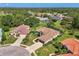 Enjoy a picturesque aerial view of the home nestled within a lush, green neighborhood at 7302 Dunes Ct, Bradenton, FL 34202
