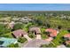 Aerial view showcasing the property's prime location within a well-maintained community and golf course at 7302 Dunes Ct, Bradenton, FL 34202