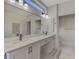 Bathroom featuring dual sinks, modern fixtures, and ample counter space at 7302 Dunes Ct, Bradenton, FL 34202