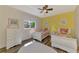 Bright bedroom featuring two twin beds, colorful decor, and natural light at 7302 Dunes Ct, Bradenton, FL 34202