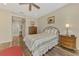 Bedroom featuring neutral tones, a ceiling fan, and wood-look floors at 7302 Dunes Ct, Bradenton, FL 34202
