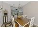Elegant dining area showcases a rustic table set and seamlessly connects to the living room at 7302 Dunes Ct, Bradenton, FL 34202