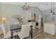 Inviting dining room features modern chandelier and views of the backyard at 7302 Dunes Ct, Bradenton, FL 34202