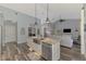 Gourmet kitchen island with stainless steel appliances, granite countertops and open floorplan at 7302 Dunes Ct, Bradenton, FL 34202