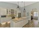 Bright kitchen with granite countertops, stainless steel appliances, and custom cabinetry at 7302 Dunes Ct, Bradenton, FL 34202