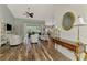 Spacious living room with views of kitchen, dining area, high ceilings and hardwood style flooring at 7302 Dunes Ct, Bradenton, FL 34202