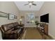 Cozy living room with a leather couch, plantation shutters, and stylish decor at 7302 Dunes Ct, Bradenton, FL 34202