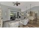 Open living room featuring vaulted ceilings, light colors, and view of screened patio at 7302 Dunes Ct, Bradenton, FL 34202
