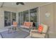 Cozy patio with comfortable seating, overlooking lush greenery, ideal for relaxing and enjoying the outdoors at 7302 Dunes Ct, Bradenton, FL 34202