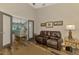 Sitting area with a leather reclining sofa adjacent to a kitchen at 7302 Dunes Ct, Bradenton, FL 34202