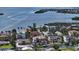 Waterfront home with lush landscaping and a private boat dock overlooking the Gulf at 795 Marbury Ln, Longboat Key, FL 34228