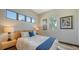 Cozy bedroom features a comfortable bed with blue accents, natural light, and stylish decor at 795 Marbury Ln, Longboat Key, FL 34228