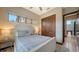Cozy bedroom featuring warm colors, natural light, and an attached wardrobe at 795 Marbury Ln, Longboat Key, FL 34228