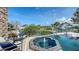 Hot tub overlooks manicured landscaping and waterfront at 795 Marbury Ln, Longboat Key, FL 34228