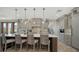 Spacious kitchen features an island with seating, stainless steel appliances, and custom cabinets at 795 Marbury Ln, Longboat Key, FL 34228