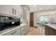 Close-up of the kitchen featuring built-in stainless steel appliances and custom cabinetry at 795 Marbury Ln, Longboat Key, FL 34228