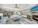 Open living area with fireplace, comfortable seating, and seamless flow into kitchen at 795 Marbury Ln, Longboat Key, FL 34228