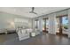 Serene main bedroom with balcony access, seating area, and elegant decor at 795 Marbury Ln, Longboat Key, FL 34228
